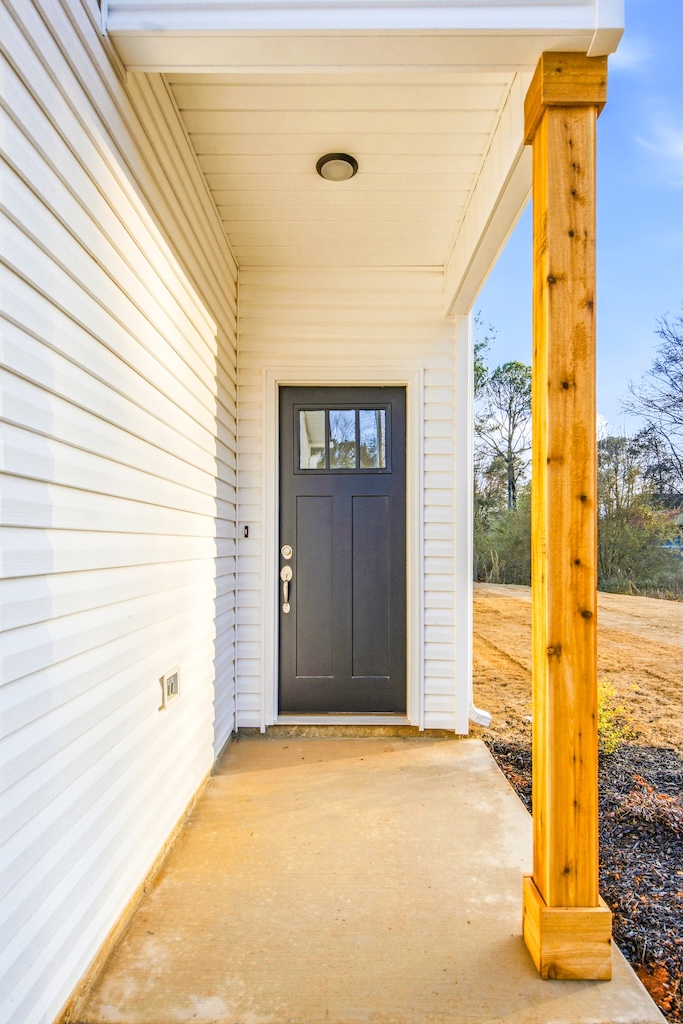 Dexter-13 The Birch floor plan covered front entry by Maplewood Homes with modern exterior design