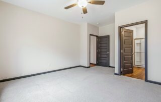 Tercel-16 Aspen floor plan primary bedroom by Maplewood Homes with ceiling fan, natural light, and spacious layout