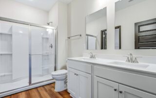 Tercel-17 Aspen floor plan primary bathroom by Maplewood Homes with double vanity and walk-in shower