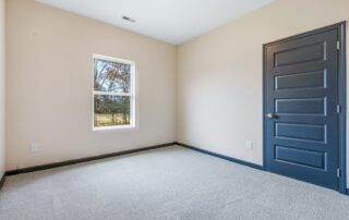 Tercel-18 Aspen floor plan secondary bedroom by Maplewood Homes with carpet flooring and neutral finishes